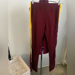 EUC Varsity Spirit cheer pants, maroon w/yellow stripe down sides. Size L in men